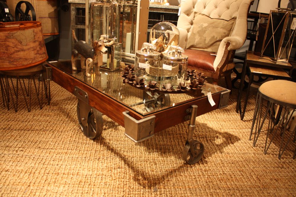 Coffee table on wheels with an industrial design